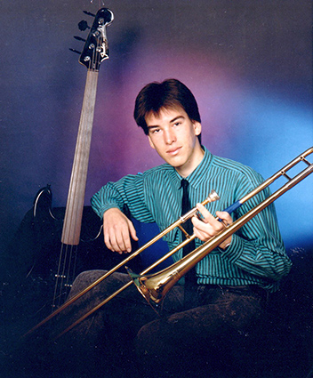 Jonathan posing with instruments at age 17